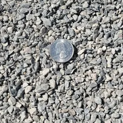 A visually appealing mix of crushed gravel stones in various shades of gray and white, offering a decorative option to enhance garden pathways, driveways, and landscaping designs.