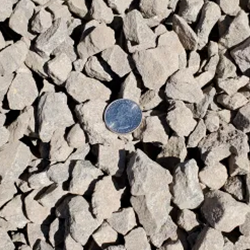 Base Course NMDOT 1 inch, showcasing a well-graded and compacted gravel mixture in compliance with the specifications of the New Mexico Department of Transportation. Available at Albuquerque Landscape Supply, this high-quality gravel provides a sturdy foundation for road construction and other infrastructure projects, ensuring durability and stability.
