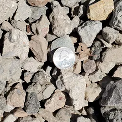CCBC Recycled Concrete Base Course 1 inch, showcasing a sustainable and durable gravel mixture made from recycled concrete, ideal for base construction. Available at Albuquerque Landscape Supply, this eco-friendly gravel provides a solid foundation for your outdoor projects. Use it for roadways, walkways, or as a base layer for hardscape installations, ensuring long-lasting performance with its recycled material composition.